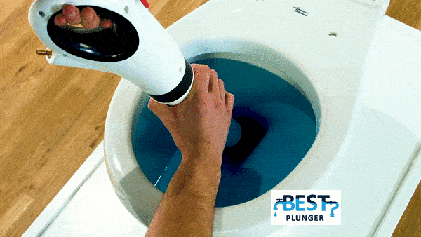 Using AirBlast Pro clog buster to clear a blocked toilet drain effectively.