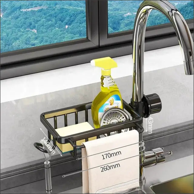 SinkSmart organizer holding cleaning supplies and a towel near the faucet