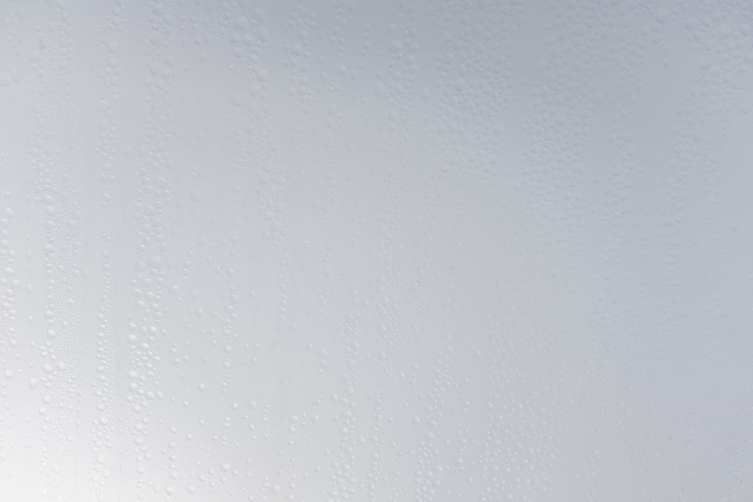 a white wall with water drops on it