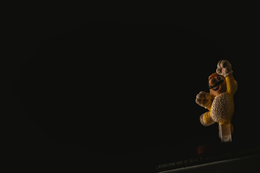 a couple of stuffed animals sitting on top of a table