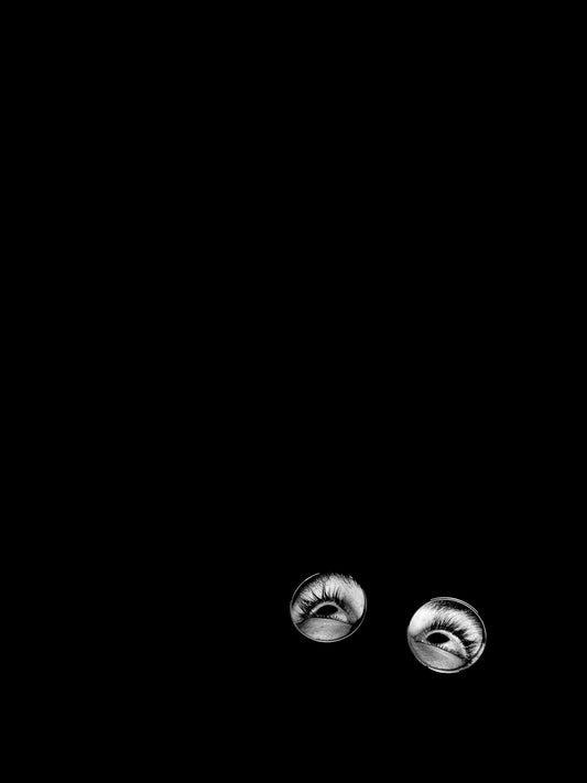 a black and white photo of a pair of eyeballs
