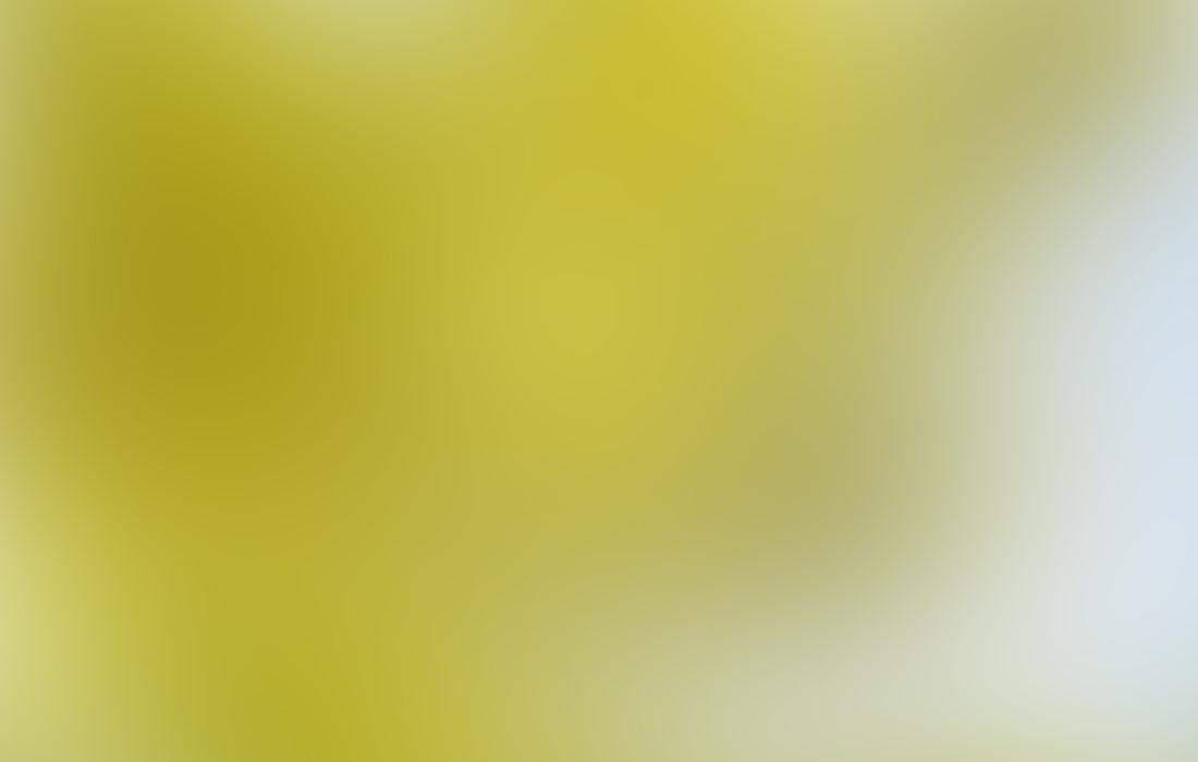 a blurry image of a yellow and blue sky