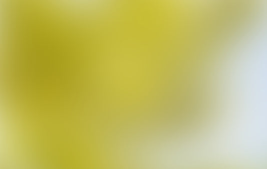 a blurry image of a yellow and blue sky