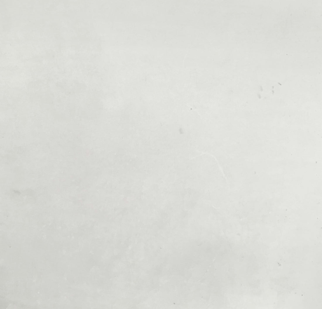 a black and white photo of a person on a surfboard