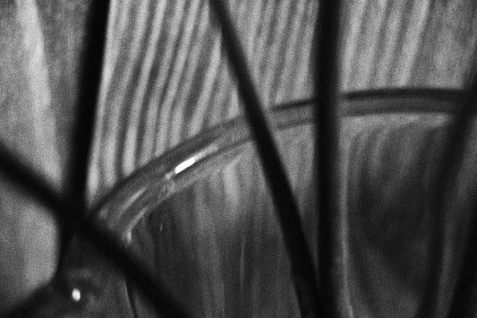 a black and white photo of a wine glass