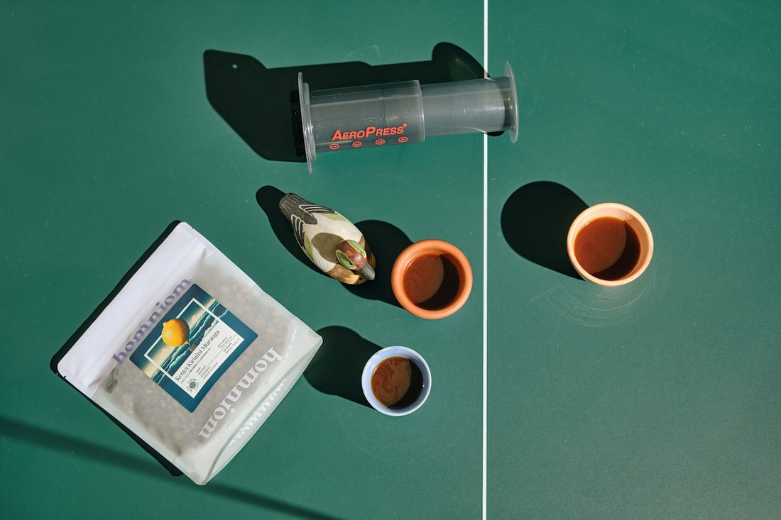 A table topped with two cups of coffee