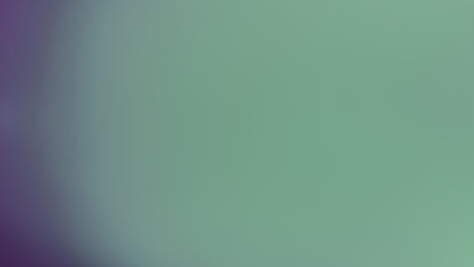 Blurred purple and green background.