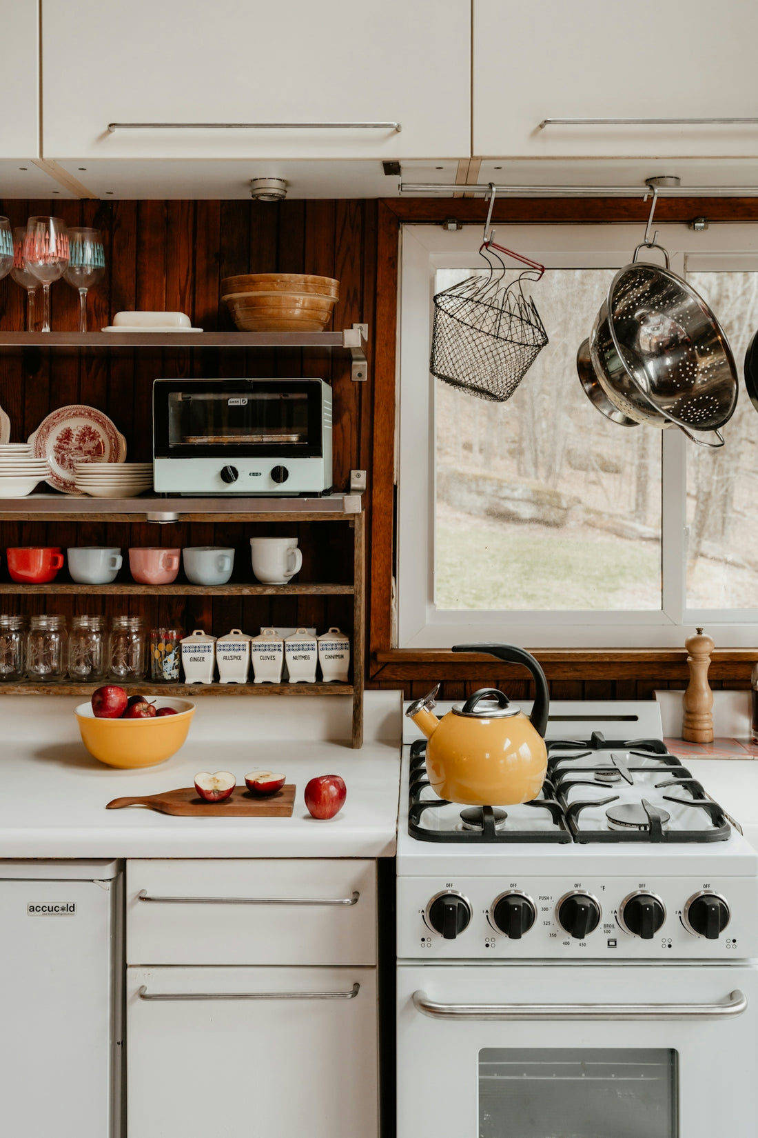 A cozy kitchen with cooking utensils.