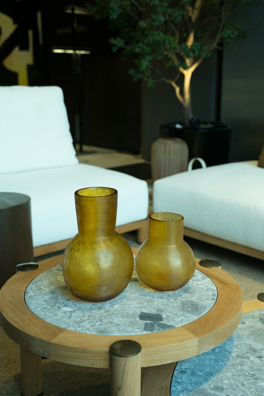 Two vases sit on a decorative coffee table.