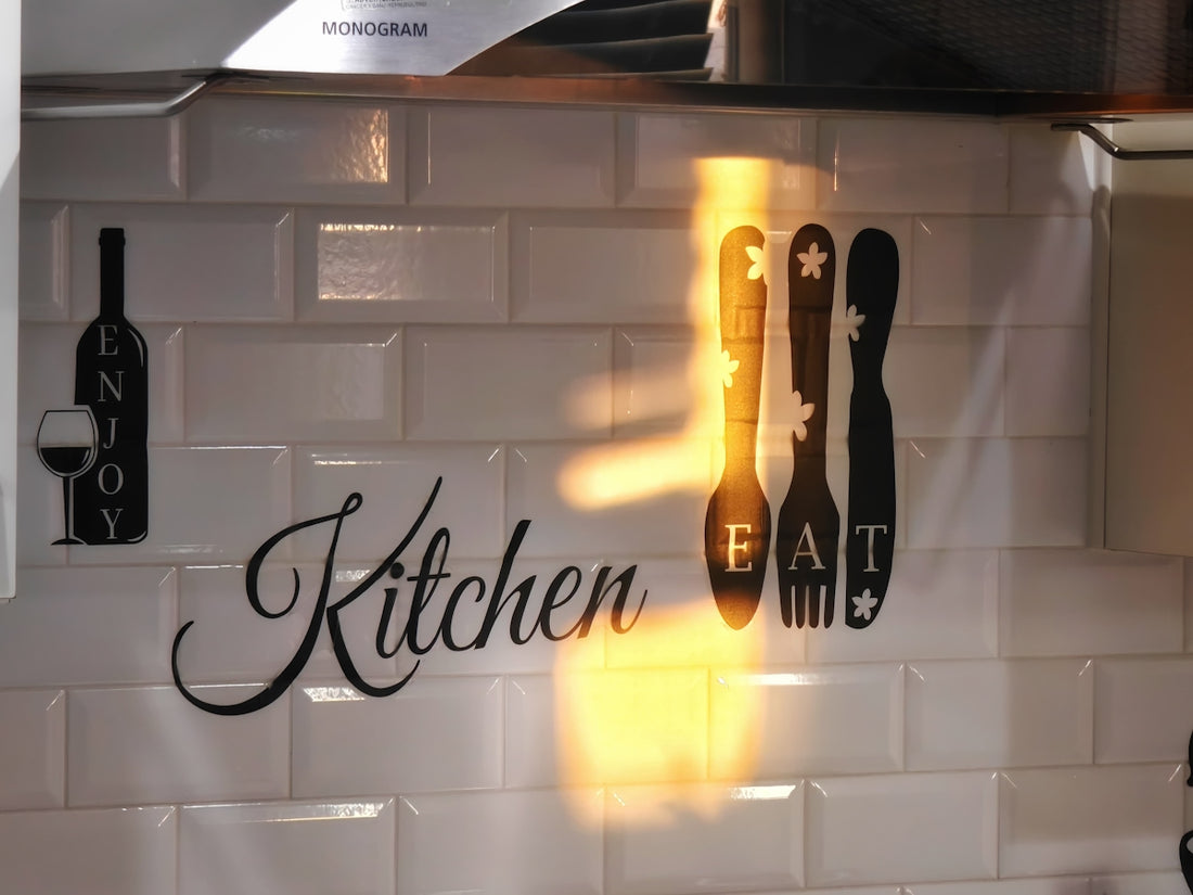Kitchen wall decor with utensils and wine bottle.