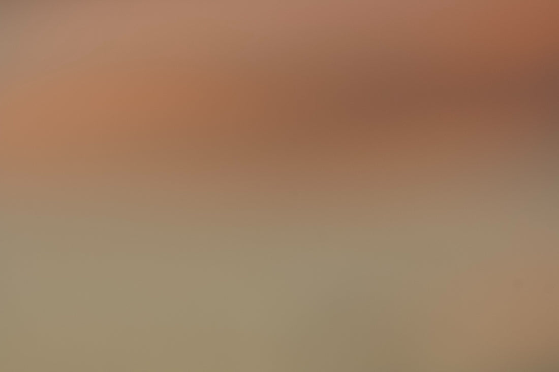 Soft gradient of warm peach and neutral beige colors.