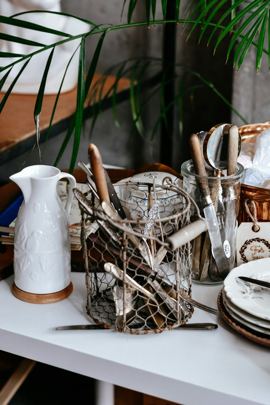 Kitchen utensils in wire holder with white pitcher