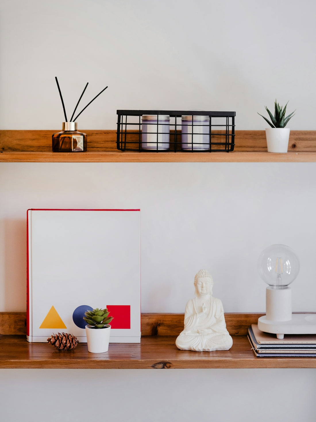 Decorative items on two wooden shelves