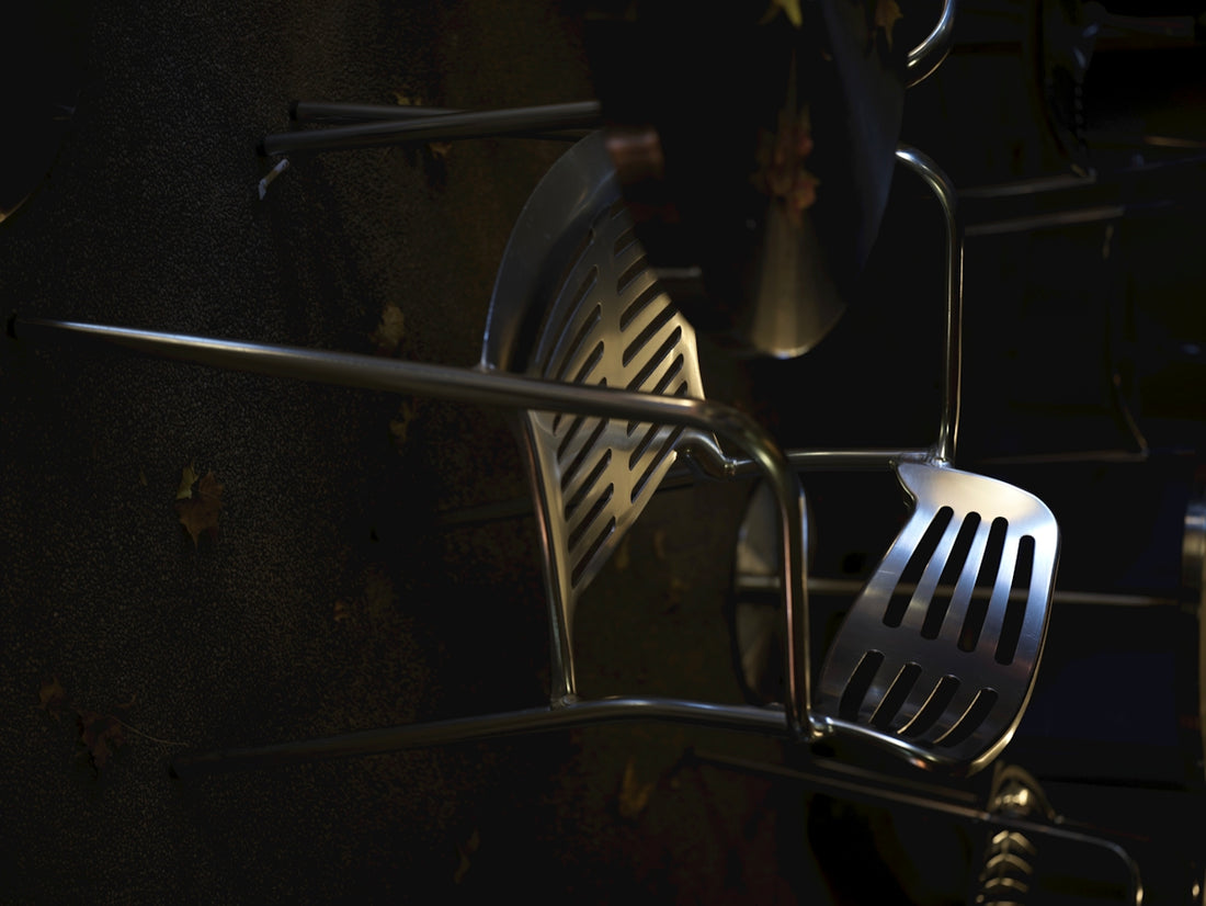 Stainless steel kitchen utensils hanging on rack