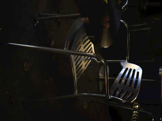 Stainless steel kitchen utensils hanging on rack