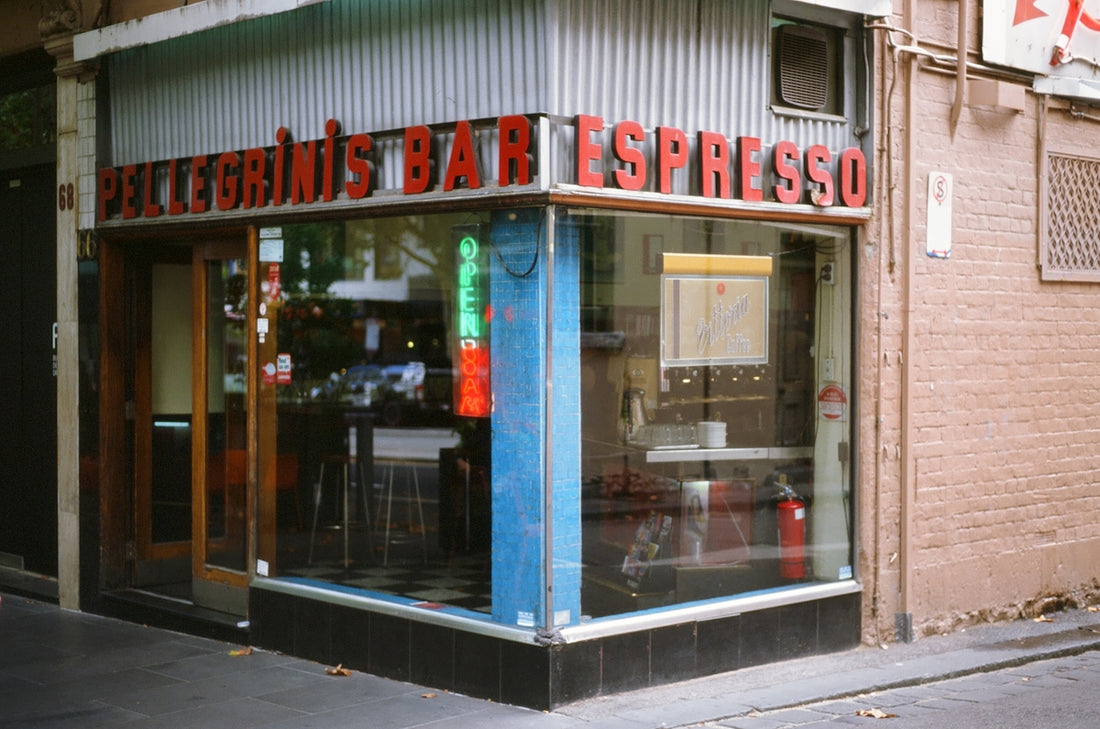 Corner storefront with sign for bullegini's bar espresso