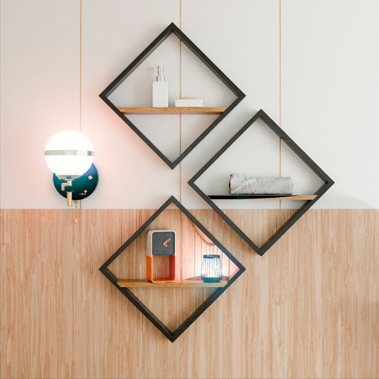 Three diamond-shaped shelves with decor on a wood-paneled wall.