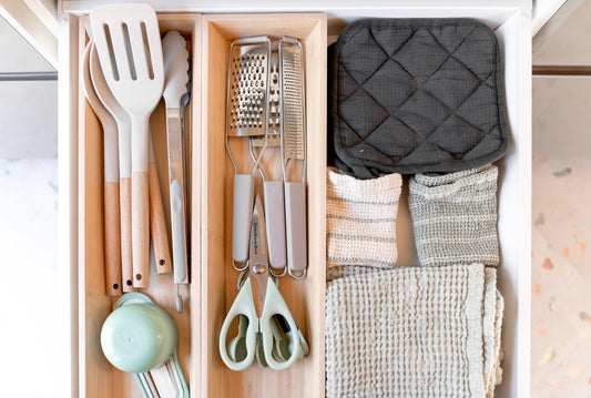 Kitchen utensils organized in a drawer organizer drawer