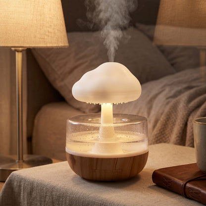 Tiny Rain Cloud Humidifier on a plush surface with colorful LED glow, creating a warm, relaxing bedside atmosphere.