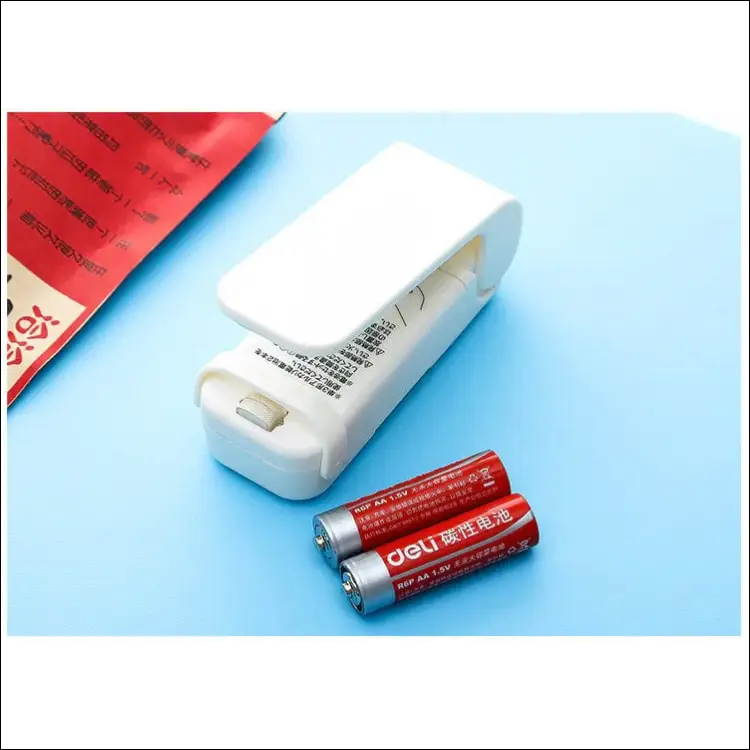 FreshSeal Pro bag sealer with batteries, compact design.