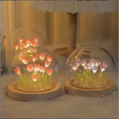 Glowing tulip dome lamps with glass and wood accents provide a soft light.